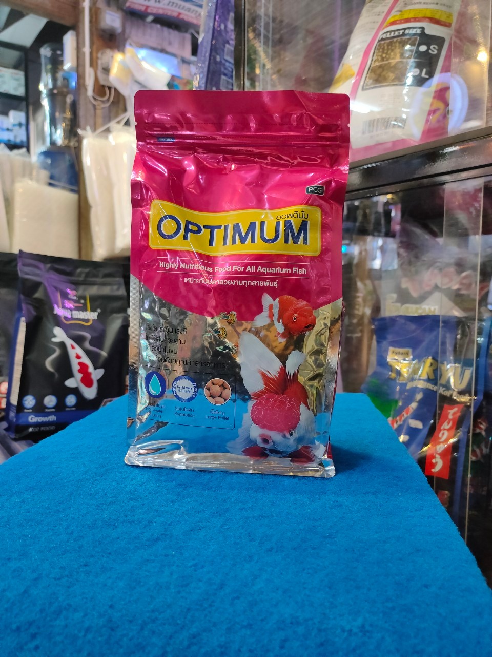 OPTIMUM สีชมพู 1KG เม็ดใหญ่(L) เหมาะกับปลาสวยทุกสายพันธ์