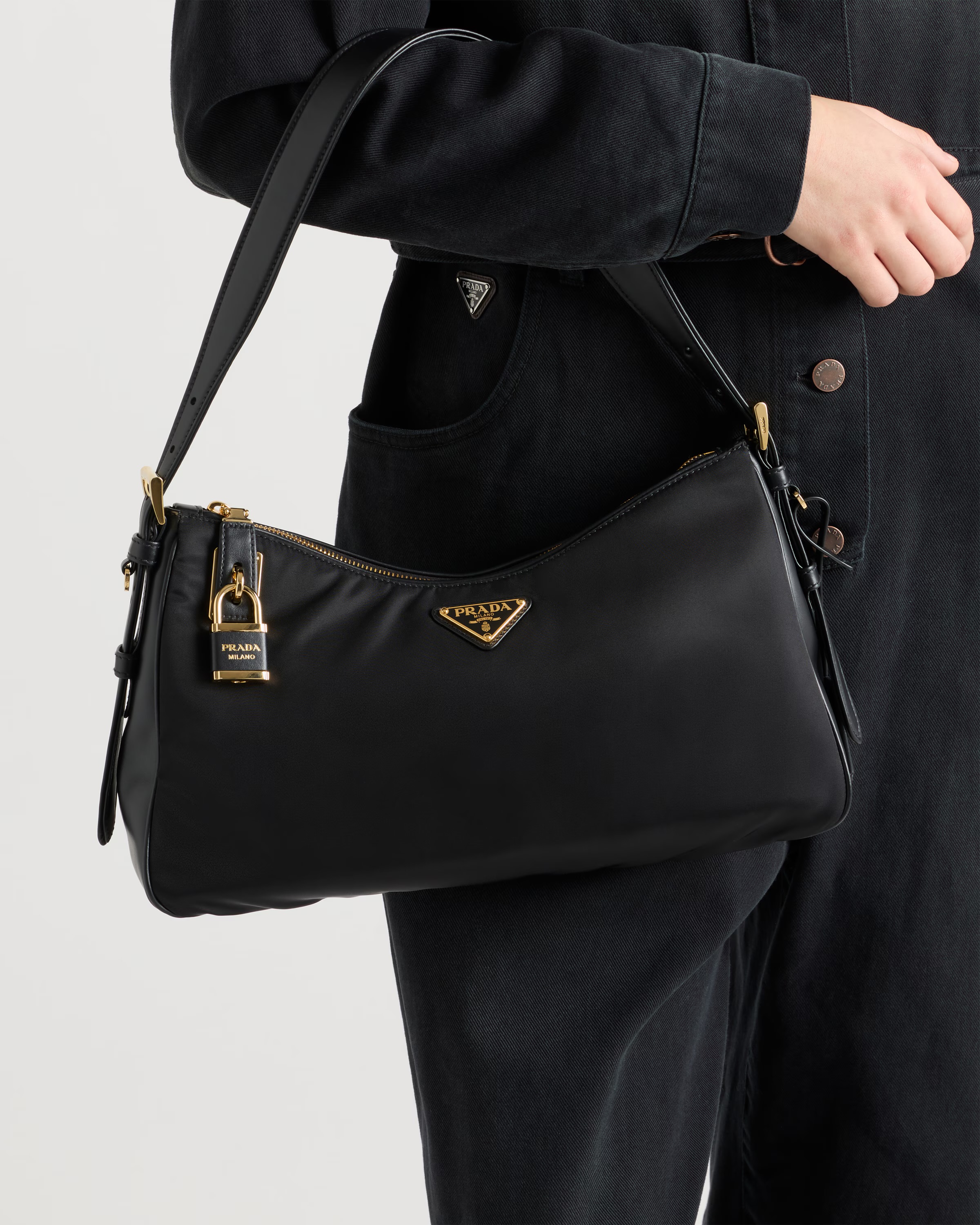 **do** กระเป๋า Prada Aimée large Re-Nylon and leather shoulder bag with padlock สินค้าใหม่ ของแท้