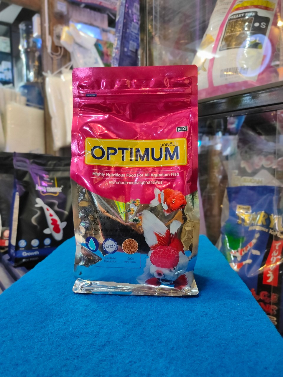 OPTIMUM สีชมพู 1KG เม็ดจิ๋ว(B) เหมาะกับปลาสวยทุกสายพันธ์
